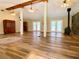 Spacious living room with wood floors, exposed beams, and a wood-burning stove at 7680 Banks Mill Road Rd, Douglasville, GA 30135