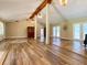 Bright living room featuring hardwood floors, exposed beams, and access to the outdoors at 7680 Banks Mill Road Rd, Douglasville, GA 30135