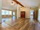 Spacious living area with hardwood floors, exposed beams, and large windows at 7680 Banks Mill Road Rd, Douglasville, GA 30135
