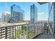 City view from the balcony, overlooking modern buildings and green trees at 860 Peachtree St # 1103, Atlanta, GA 30308