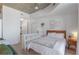 Bedroom area with in-unit laundry, modern storage, and hardwood floors at 860 Peachtree St # 1103, Atlanta, GA 30308