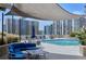 The community's outdoor pool is shaded and surrounded by patio furniture at 860 Peachtree St # 1103, Atlanta, GA 30308