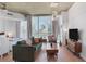 Living room with hardwood floors, city views, modern lighting, and sleeping area at 860 Peachtree St # 1103, Atlanta, GA 30308
