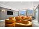 Community theater room with a large screen TV, soft lighting and comfortable seating at 860 Peachtree St # 1103, Atlanta, GA 30308