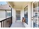 Balcony view with wrought iron railing and door with interior blinds at 3275 Lenox Ne Rd # 413, Atlanta, GA 30324
