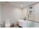 This primary bathroom includes a free standing soaking tub, stand alone shower and modern finishes at 3275 Lenox Ne Rd # 413, Atlanta, GA 30324