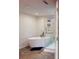 Bright bathroom with a stand-alone soaking tub and glass shower at 3275 Lenox Ne Rd # 413, Atlanta, GA 30324