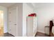Hallway view of a bedroom with a white dresser, closet, and ensuite bathroom at 3275 Lenox Ne Rd # 413, Atlanta, GA 30324