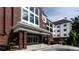 Attractive building exterior with brick accents and modern architecture; professionally landscaped for curb appeal at 3275 Lenox Ne Rd # 413, Atlanta, GA 30324
