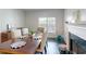 A well-lit dining room complemented by a fireplace and window at 3275 Lenox Ne Rd # 413, Atlanta, GA 30324