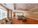 Game room featuring a pool table, sofas, and a view of the outdoors for a relaxing setting at 3275 Lenox Ne Rd # 413, Atlanta, GA 30324