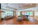 Comfortable game room with sofas, tables, and a pool table for residents to enjoy at 3275 Lenox Ne Rd # 413, Atlanta, GA 30324