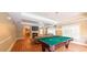 Entertainment space with a fireplace, a TV, a pool table and sofas for relaxation at 3275 Lenox Ne Rd # 413, Atlanta, GA 30324