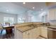 Bright kitchen with granite counters, stainless steel appliances, and a breakfast bar overlooking dining area at 3275 Lenox Ne Rd # 413, Atlanta, GA 30324