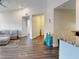 Living area showcasing open concept with sofa, bar seating, and hardwood floors at 3275 Lenox Ne Rd # 413, Atlanta, GA 30324