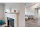The living room is enhanced by the fireplace, sofa and wood floors at 3275 Lenox Ne Rd # 413, Atlanta, GA 30324