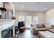 Inviting living room featuring a fireplace, hardwood floors, and a cozy couch, perfect for relaxation at 3275 Lenox Ne Rd # 413, Atlanta, GA 30324