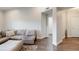 Spacious living area with hardwood floors and a comfortable couch for relaxing or entertaining at 3275 Lenox Ne Rd # 413, Atlanta, GA 30324