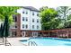Outdoor pool with lounge chairs and a patio for residents to relax and enjoy the sun at 3275 Lenox Ne Rd # 413, Atlanta, GA 30324