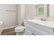 Well-lit bathroom featuring a clean, white vanity and fixtures at 7420 Bristol Cir, Douglasville, GA 30134
