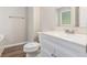 Bathroom features a white vanity with new countertops and brushed nickel faucet at 7420 Bristol Cir, Douglasville, GA 30134
