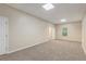 Spacious bedroom with neutral carpet, ample natural light, and potential for versatile use at 7420 Bristol Cir, Douglasville, GA 30134