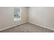 Neutral bedroom with neutral carpet and natural light at 7420 Bristol Cir, Douglasville, GA 30134