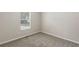 This bedroom is painted in neutral colors and features a plush carpet at 7420 Bristol Cir, Douglasville, GA 30134