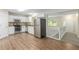 Kitchen and entry showcasing stainless steel appliances and an eat-in breakfast area at 7420 Bristol Cir, Douglasville, GA 30134