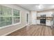 Updated eat-in kitchen with stainless steel appliances and modern flooring at 7420 Bristol Cir, Douglasville, GA 30134