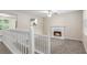 Inviting living area with a cozy fireplace, neutral carpet, and natural light at 7420 Bristol Cir, Douglasville, GA 30134