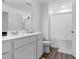 Bright bathroom with a shower, tub, and clean white finishes at 161 Swindon Dr, Mcdonough, GA 30253