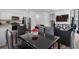 Open-concept dining area flowing into the kitchen and living room, creating a welcoming space for entertaining at 161 Swindon Dr, Mcdonough, GA 30253