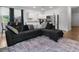 Open-concept living area with a modern kitchen and stylish furniture at 161 Swindon Dr, Mcdonough, GA 30253