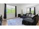 Comfortable living room with large windows and modern decor at 161 Swindon Dr, Mcdonough, GA 30253