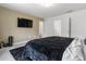 Spacious main bedroom with a large bed, a television, and neutral wall colors at 161 Swindon Dr, Mcdonough, GA 30253