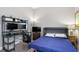 Spare bedroom with a murphy bed, desk with computer monitors, side table with lamp, and neutral paint at 1903 Anjaco Rd # 5, Atlanta, GA 30309