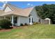 The backyard features a well-manicured lawn and a glimpse of an outdoor gazebo, ideal for relaxation and entertaining at 345 Annslee Circle Cir, Loganville, GA 30052