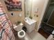 Well-lit bathroom with decorative mirrors, art, and a single sink vanity at 345 Annslee Circle Cir, Loganville, GA 30052
