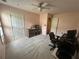 Small bedroom with grey carpet, peach paint and office space at 345 Annslee Circle Cir, Loganville, GA 30052