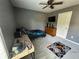Cozy bedroom with gray walls and carpet, a ceiling fan, and a comfortable bed at 345 Annslee Circle Cir, Loganville, GA 30052