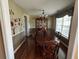 Traditional dining room features a wooden table with chairs, hardwood floors, and decorative lighting at 345 Annslee Circle Cir, Loganville, GA 30052