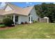 Well-manicured lawn and garden, along with light siding and bay window at 345 Annslee Circle Cir, Loganville, GA 30052
