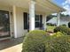Covered front porch with rocking chairs and manicured shrubs at 345 Annslee Circle Cir, Loganville, GA 30052