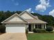Charming single-story home with well-manicured lawn and two-car garage at 345 Annslee Circle Cir, Loganville, GA 30052