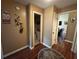 Hallway leading to bathroom and living area, featuring elegant decor and warm neutral tones at 345 Annslee Circle Cir, Loganville, GA 30052