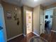 Hallway leading to bathroom and living area, featuring elegant decor and warm neutral tones at 345 Annslee Circle Cir, Loganville, GA 30052