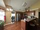 Kitchen featuring stainless steel appliances, wooden cabinets, breakfast bar, and hardwood flooring at 345 Annslee Circle Cir, Loganville, GA 30052