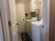 Laundry room with white washer and dryer, cabinets, and tiled floor at 345 Annslee Circle Cir, Loganville, GA 30052
