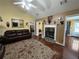 Well-lit living room with stone fireplace and hardwood floors at 345 Annslee Circle Cir, Loganville, GA 30052